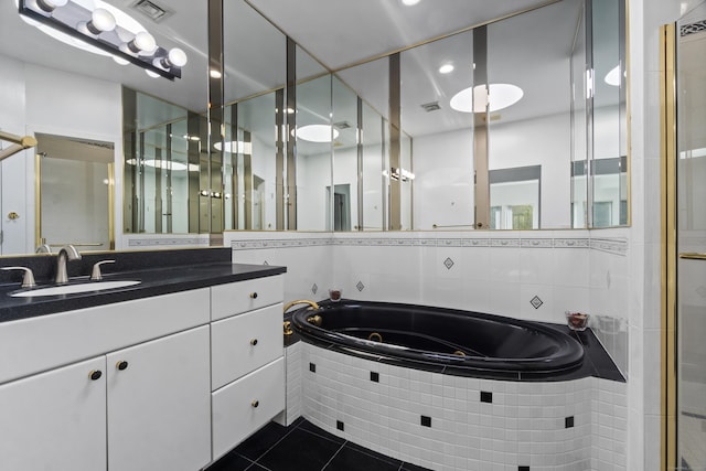 45 Brookview Ct, Groton, CT 06340 - full bath with tile patterned floors, a jetted tub, vanity, a stall shower, and recessed lighting
