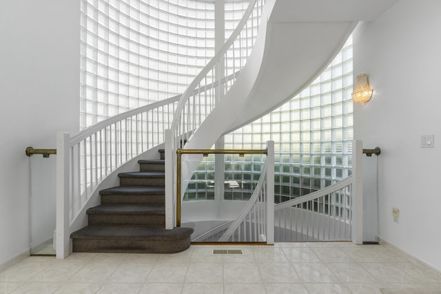 45 Brookview Ct, Groton, CT 06340 - stairs with baseboards and tile patterned floors