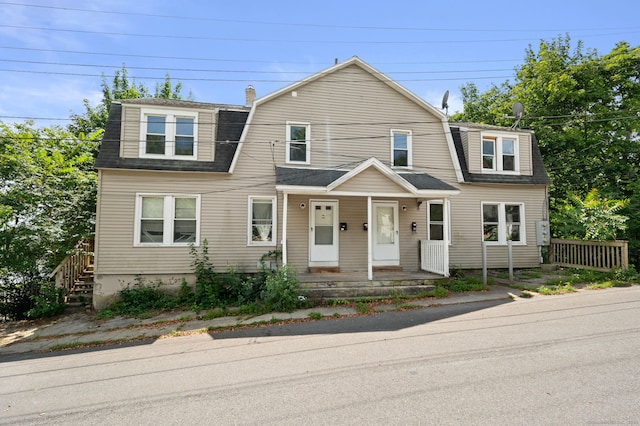49 Freeman Ave, Norwich, CT 06360 - colonial inspired home with a gambrel roof, a shingled roof, a chimney, and covered porch