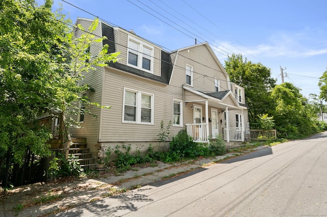 49 Freeman Ave, Norwich, CT 06360 - view of front facade featuring a porch, a gambrel roof, and roof with shingles