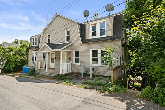 49 Freeman Ave, Norwich, CT 06360 - view of front of property with a shingled roof, a gambrel roof, covered porch, and a chimney