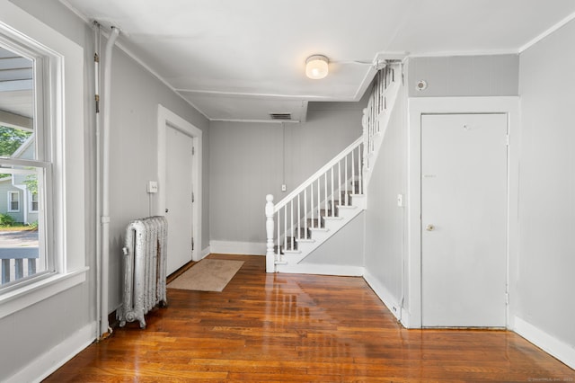 49 Freeman Ave, Norwich, CT 06360 - entrance foyer with radiator heating unit, stairs, and wood finished floors