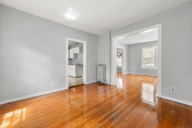 49 Freeman Ave, Norwich, CT 06360 - spare room featuring radiator and light wood-style flooring