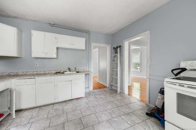 49 Freeman Ave, Norwich, CT 06360 - kitchen featuring white appliances, light countertops, and white cabinetry