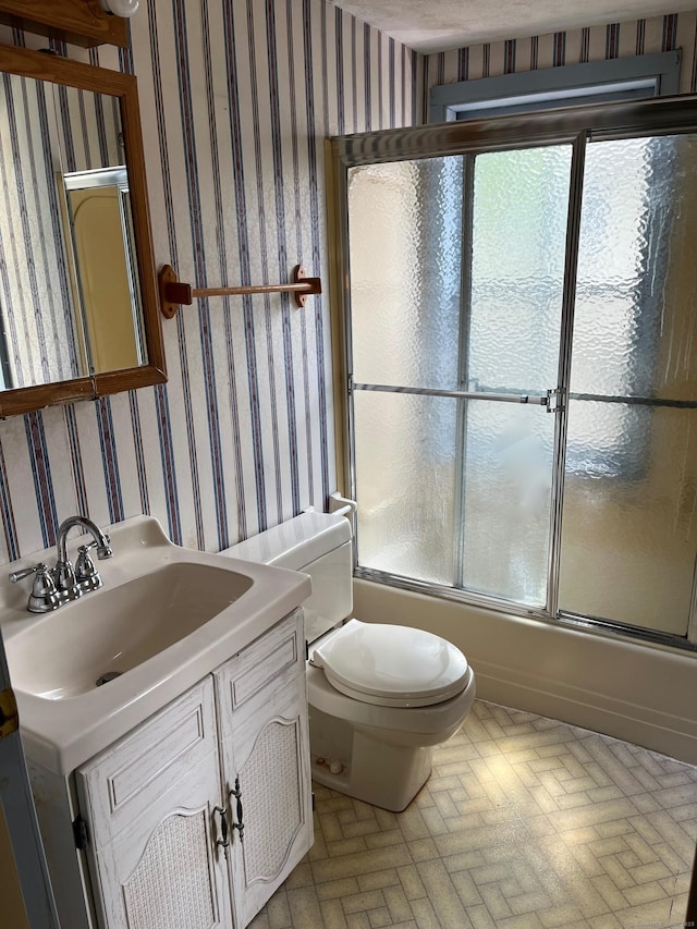 57 New Britain Ave, Farmington, CT 06085 - full bathroom with wallpapered walls, brick patterned flooring, bath / shower combo with glass door, and vanity