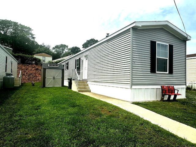 435 High St Lot 10, Groton, CT 06355 - view of home's exterior with a shed, a yard, and entry steps