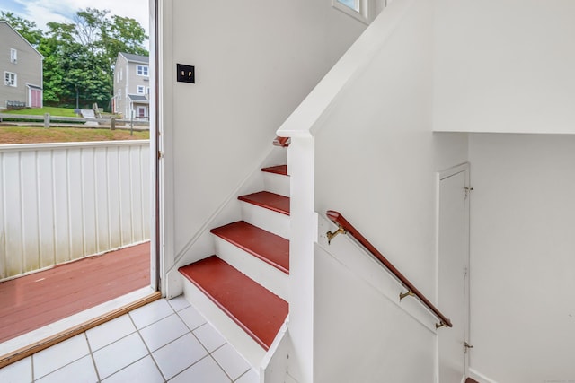 173 Russo Ave Unit 409, East Haven, CT 06513 - stairs with plenty of natural light and tile patterned flooring