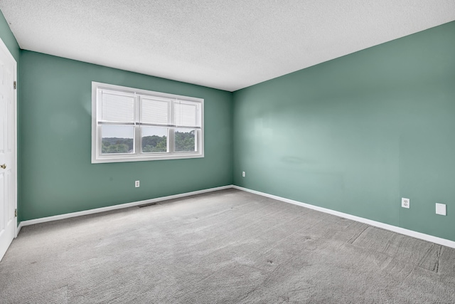173 Russo Ave Unit 409, East Haven, CT 06513 - carpeted spare room featuring a textured ceiling and baseboards