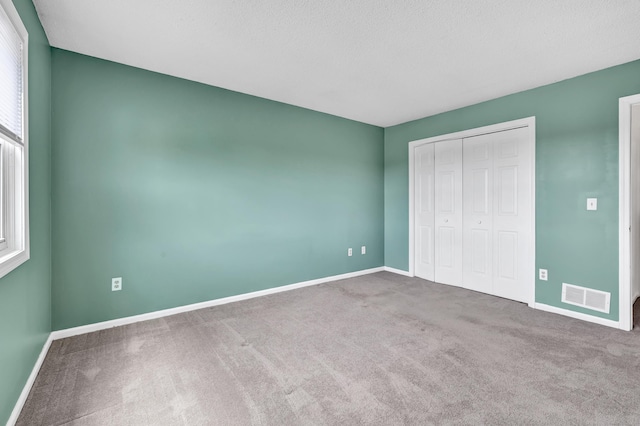 173 Russo Ave Unit 409, East Haven, CT 06513 - unfurnished bedroom with carpet floors and a closet