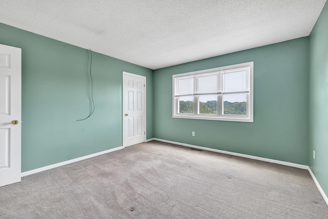 173 Russo Ave Unit 409, East Haven, CT 06513 - unfurnished bedroom with a textured ceiling and carpet floors