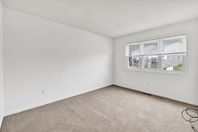 173 Russo Ave Unit 409, East Haven, CT 06513 - carpeted spare room with a textured ceiling and baseboards