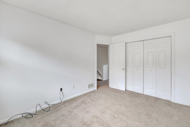173 Russo Ave Unit 409, East Haven, CT 06513 - unfurnished bedroom with carpet floors and a closet