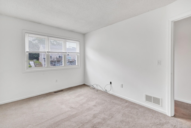 173 Russo Ave Unit 409, East Haven, CT 06513 - spare room with carpet floors and a textured ceiling