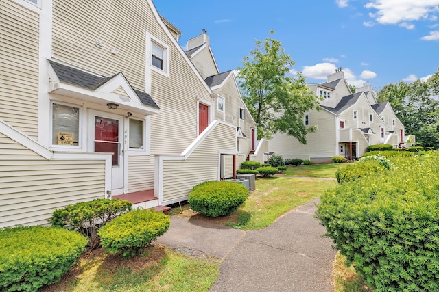 173 Russo Ave Unit 409, East Haven, CT 06513 - view of home's exterior featuring a yard and a residential view