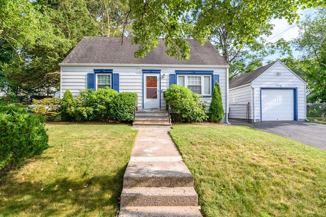 40 Rosina Rd, Hamden, CT 06514 - cape cod house featuring a garage, an outdoor structure, a front yard, and asphalt driveway
