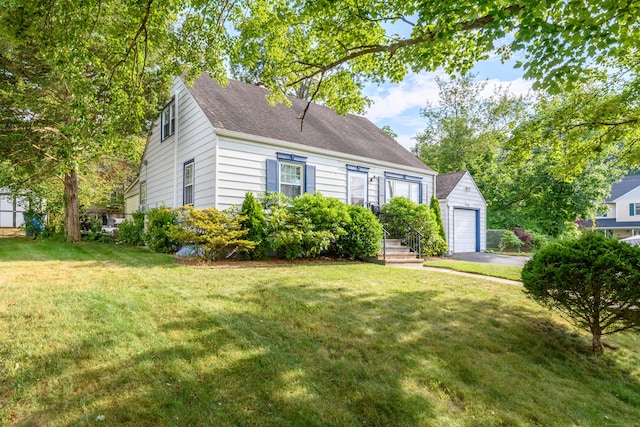 40 Rosina Rd, Hamden, CT 06514 - view of front facade featuring an outbuilding, asphalt driveway, a front yard, and a shingled roof