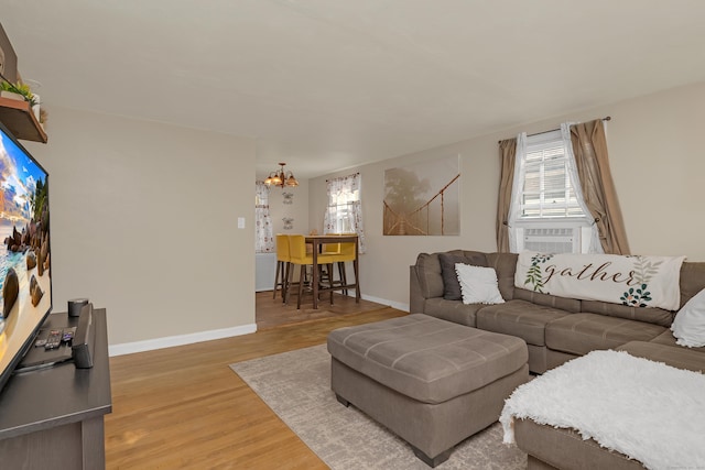 40 Rosina Rd, Hamden, CT 06514 - living area with a chandelier, light wood-type flooring, plenty of natural light, and cooling unit