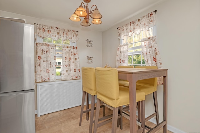 40 Rosina Rd, Hamden, CT 06514 - dining space featuring healthy amount of natural light, a chandelier, and radiator heating unit