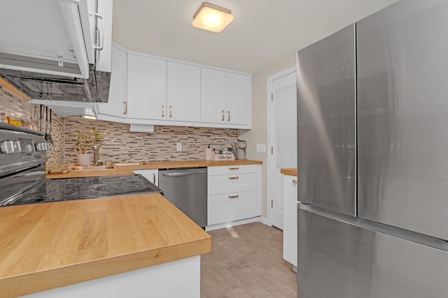 40 Rosina Rd, Hamden, CT 06514 - kitchen with stainless steel appliances, butcher block countertops, backsplash, and white cabinets