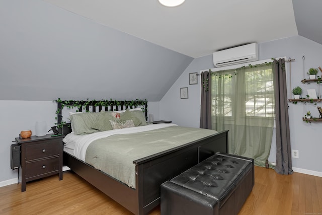 40 Rosina Rd, Hamden, CT 06514 - bedroom featuring a wall mounted air conditioner, lofted ceiling, and light wood-type flooring
