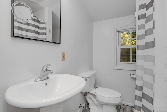 40 Rosina Rd, Hamden, CT 06514 - full bath with vaulted ceiling, a shower with curtain, and tile patterned flooring