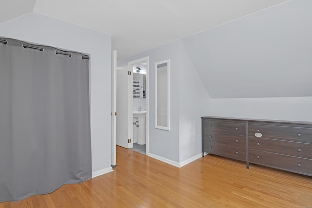 40 Rosina Rd, Hamden, CT 06514 - unfurnished bedroom with light wood-style floors and lofted ceiling