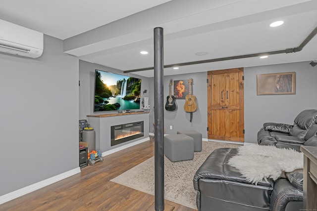 40 Rosina Rd, Hamden, CT 06514 - living area featuring an AC wall unit, recessed lighting, wood finished floors, and a glass covered fireplace