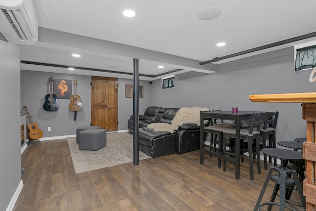 40 Rosina Rd, Hamden, CT 06514 - living room with a wall unit AC, wood finished floors, and recessed lighting