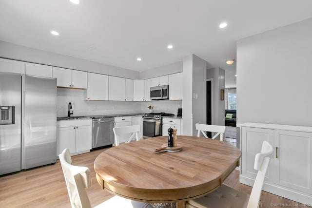121 Russo Ave Unit 11, East Haven, CT 06513 - dining space featuring light wood finished floors and recessed lighting