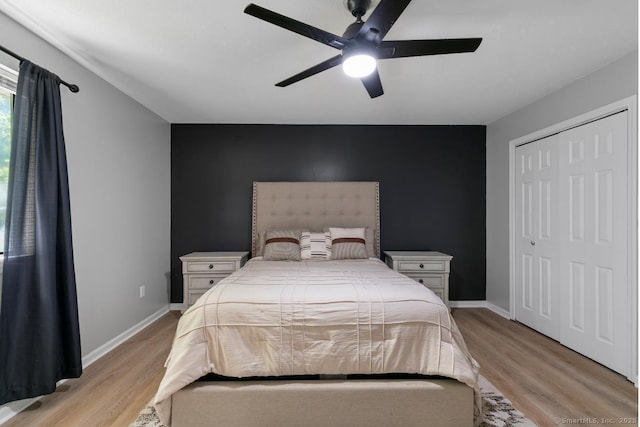121 Russo Ave Unit 11, East Haven, CT 06513 - bedroom with light wood-style flooring, ceiling fan, and a closet