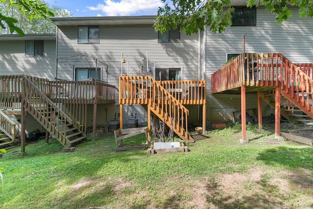 121 Russo Ave Unit 11, East Haven, CT 06513 - back of property with stairs, a wooden deck, and a lawn