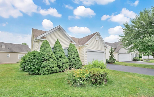 6 Mountainview Cir Unit 6, Ellington, CT 06029 - obstructed view of property featuring a front yard, driveway, and an attached garage