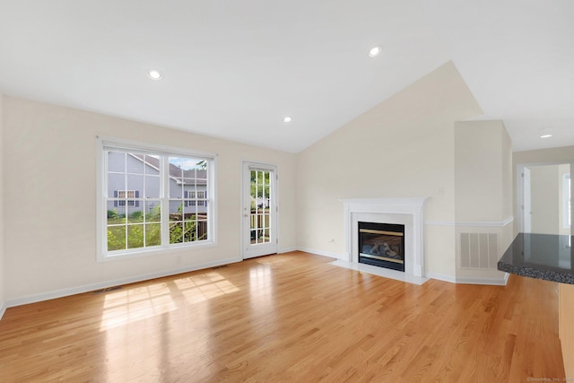 6 Mountainview Cir Unit 6, Ellington, CT 06029 - unfurnished living room with light wood-type flooring, a high end fireplace, vaulted ceiling, and recessed lighting