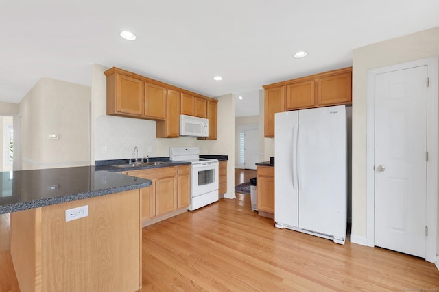 6 Mountainview Cir Unit 6, Ellington, CT 06029 - kitchen featuring white appliances, light wood-style flooring, recessed lighting, dark stone counters, and a peninsula