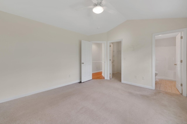 6 Mountainview Cir Unit 6, Ellington, CT 06029 - unfurnished bedroom with light colored carpet, vaulted ceiling, a walk in closet, ensuite bathroom, and a closet