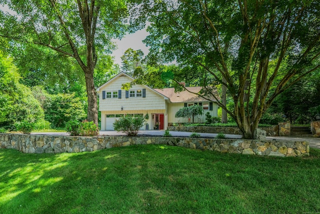 24 Buttonball Ln, Glastonbury, CT 06033 - view of front of house featuring a garage and a front yard