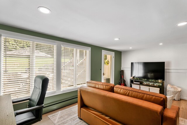 24 Buttonball Ln, Glastonbury, CT 06033 - living room featuring a baseboard heating unit, light wood-style floors, and recessed lighting