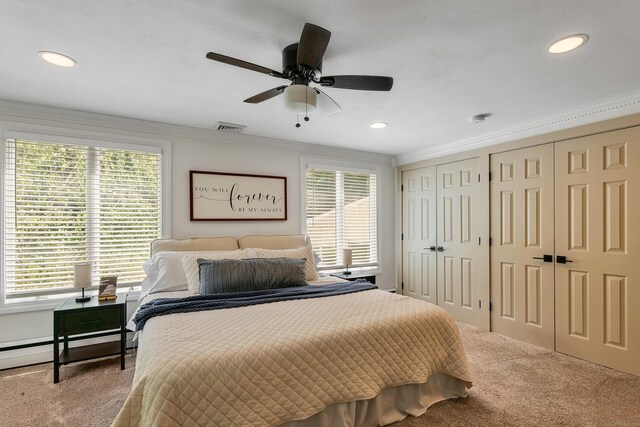 24 Buttonball Ln, Glastonbury, CT 06033 - bedroom with carpet flooring, two closets, ornamental molding, recessed lighting, and ceiling fan