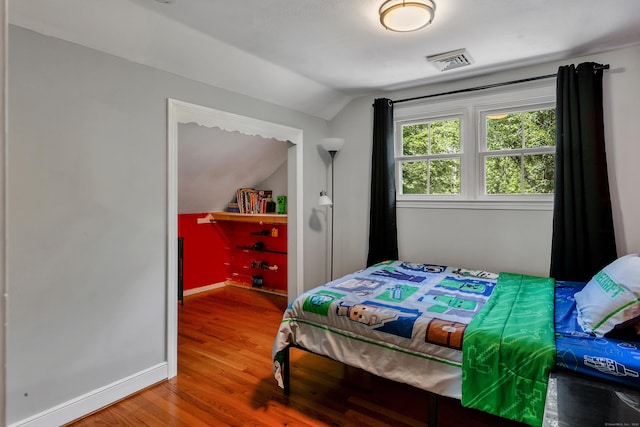 24 Buttonball Ln, Glastonbury, CT 06033 - bedroom with vaulted ceiling and wood finished floors