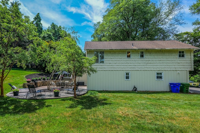 24 Buttonball Ln, Glastonbury, CT 06033 - back of house with a patio area, a yard, and a shingled roof