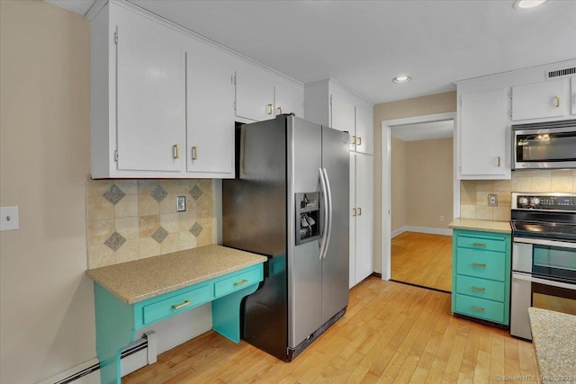 53 Montclair Dr, Manchester, CT 06042 - kitchen featuring appliances with stainless steel finishes, a baseboard radiator, decorative backsplash, light wood-style flooring, and recessed lighting