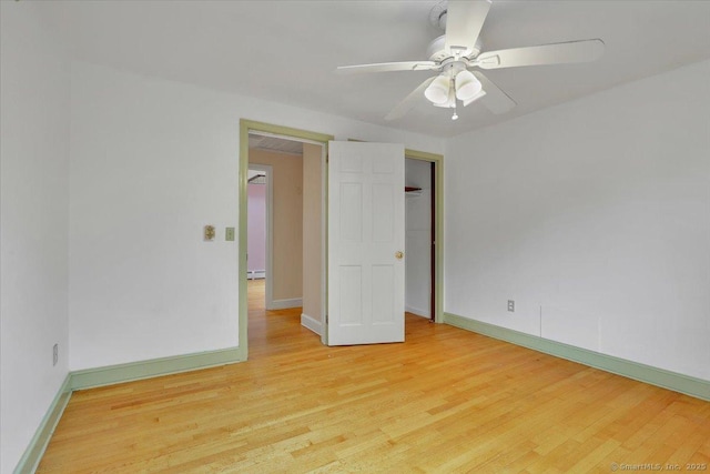 53 Montclair Dr, Manchester, CT 06042 - empty room with light wood-style floors, ceiling fan, and a baseboard heating unit