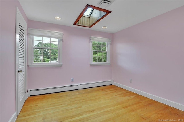 53 Montclair Dr, Manchester, CT 06042 - unfurnished room with baseboard heating, light wood-style floors, a skylight, and recessed lighting