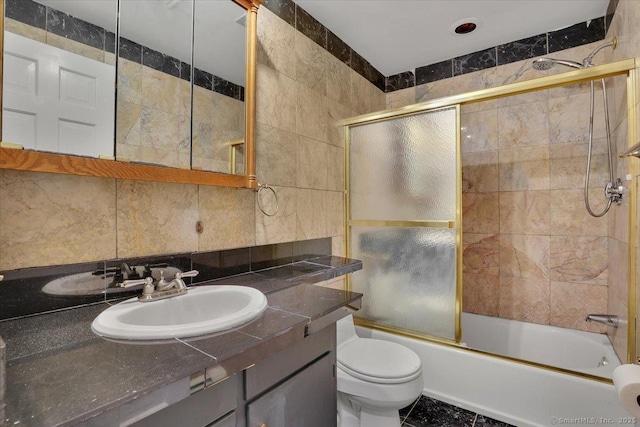 53 Montclair Dr, Manchester, CT 06042 - bathroom with tile walls, vanity, and bath / shower combo with glass door