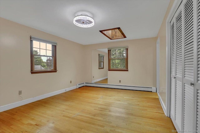 53 Montclair Dr, Manchester, CT 06042 - unfurnished bedroom featuring a baseboard radiator, light wood finished floors, and a closet