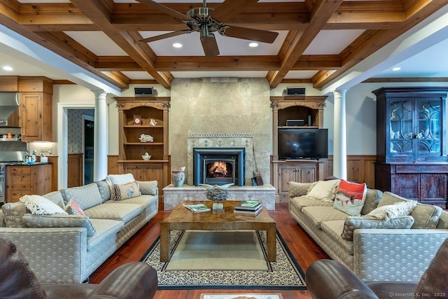 living room featuring ornate columns, wood finished floors, beam ceiling, ceiling fan, and coffered ceiling