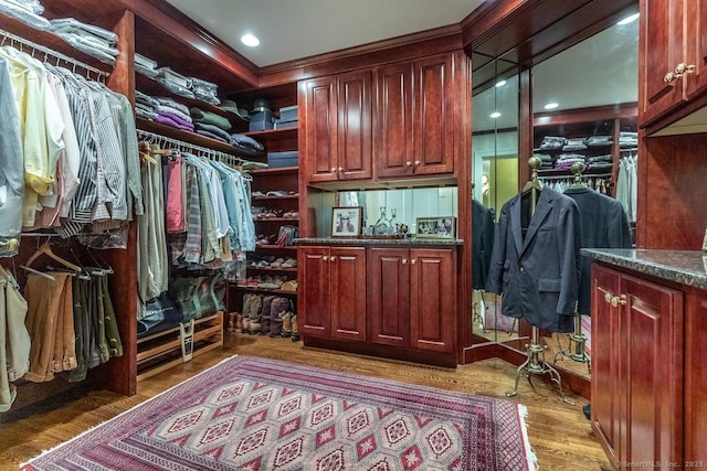 spacious closet with wood finished floors