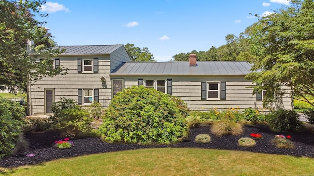 45 Canton Rd, Granby, CT 06035 - split level home with a standing seam roof, a chimney, and a metal roof