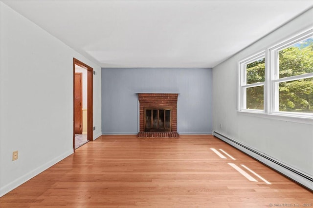 45 Canton Rd, Granby, CT 06035 - unfurnished living room featuring a baseboard radiator, light wood finished floors, and a fireplace