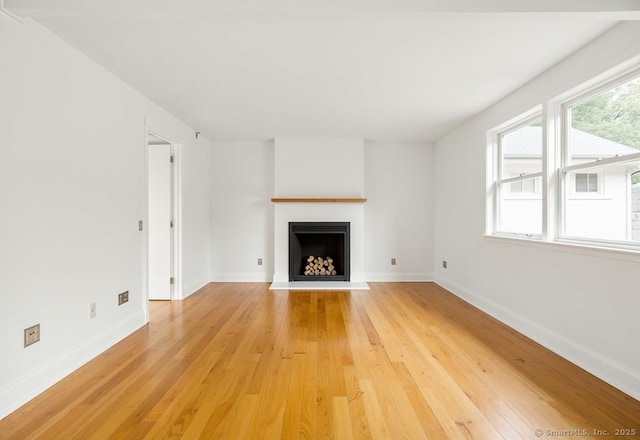 45 Canton Rd, Granby, CT 06035 - unfurnished living room featuring light wood finished floors and a fireplace